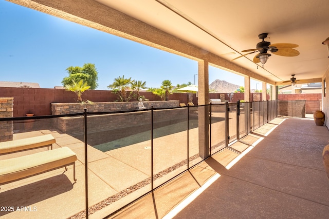 3597 W Mineral Butte Dr, San Tan Valley, AZ 85144 - fenced backyard featuring ceiling fan, a patio area, and area for grilling