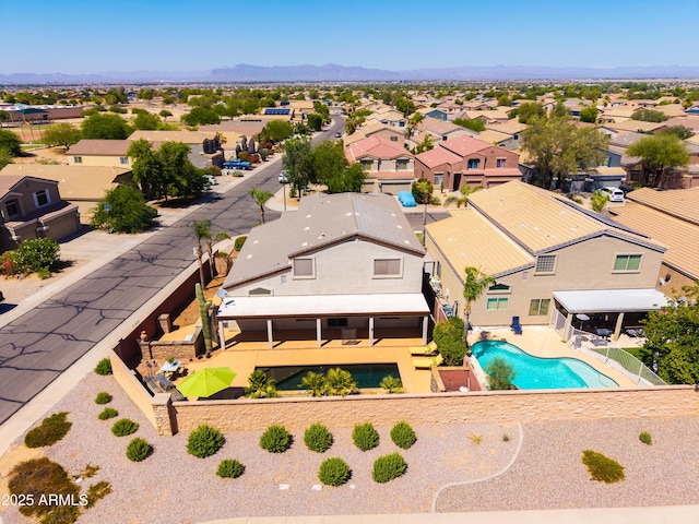 3597 W Mineral Butte Dr, San Tan Valley, AZ 85144 - aerial perspective of suburban area featuring a pool and a mountainous background