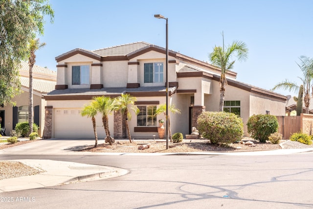 3597 W Mineral Butte Dr, San Tan Valley, AZ 85144 - view of front of property featuring an attached garage, stucco siding, driveway, and a tiled roof