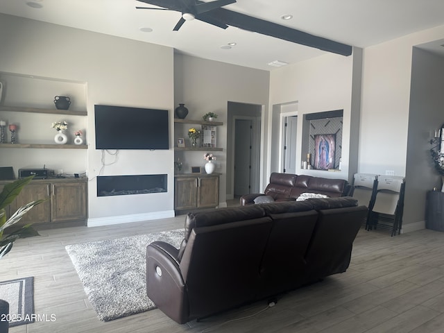 29476 N Wolfe Trl, Florence, AZ 85132 - living room with light wood-style flooring, ceiling fan, and baseboards