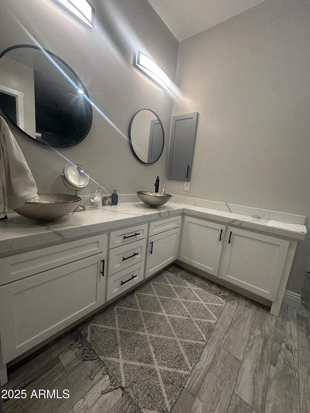 29476 N Wolfe Trl, Florence, AZ 85132 - full bathroom featuring double vanity and wood finished floors