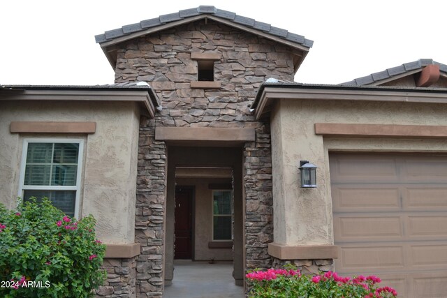 entrance to property with a garage