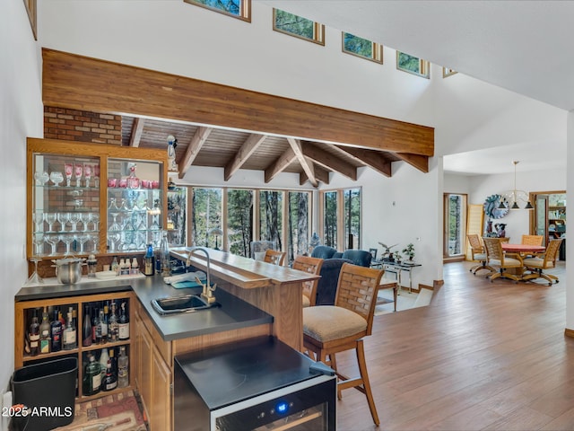 951 N Sky View St, Flagstaff, AZ 86004 - indoor wet bar featuring healthy amount of natural light and light wood-style floors