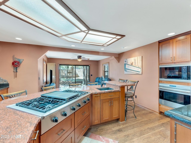 951 N Sky View St, Flagstaff, AZ 86004 - kitchen featuring stainless steel appliances, a sink, light wood-style flooring, recessed lighting, and ceiling fan