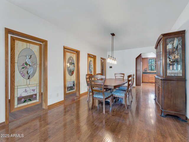 951 N Sky View St, Flagstaff, AZ 86004 - dining space with wood finished floors, baseboards, and arched walkways