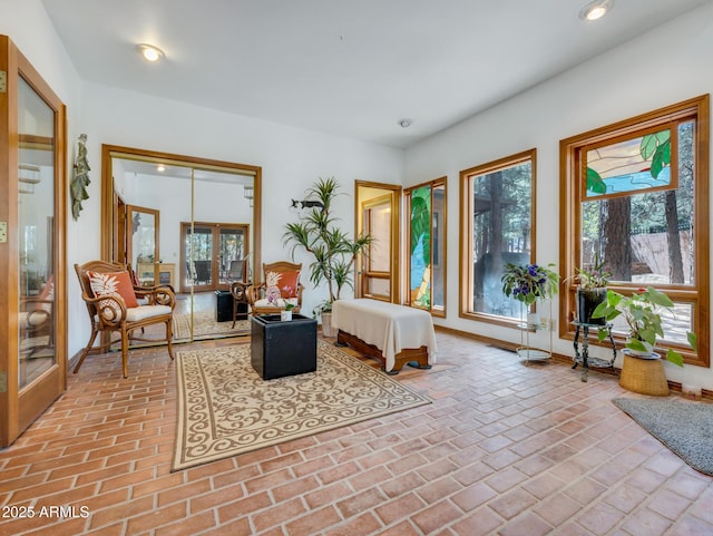 951 N Sky View St, Flagstaff, AZ 86004 - living area with plenty of natural light, baseboards, brick floors, and recessed lighting