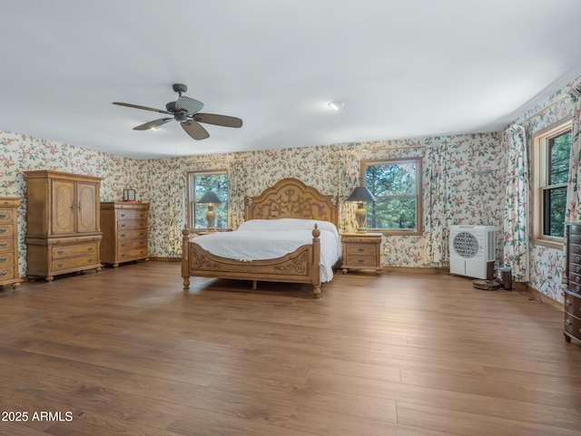 951 N Sky View St, Flagstaff, AZ 86004 - bedroom featuring wallpapered walls, wood finished floors, baseboards, and a ceiling fan