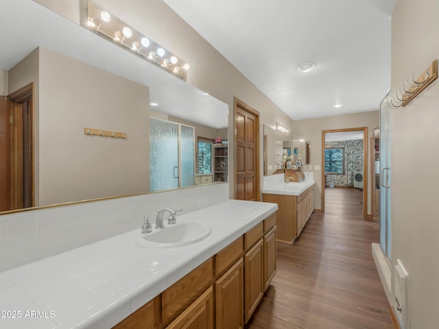 951 N Sky View St, Flagstaff, AZ 86004 - ensuite bathroom with wood finished floors, vanity, and a stall shower