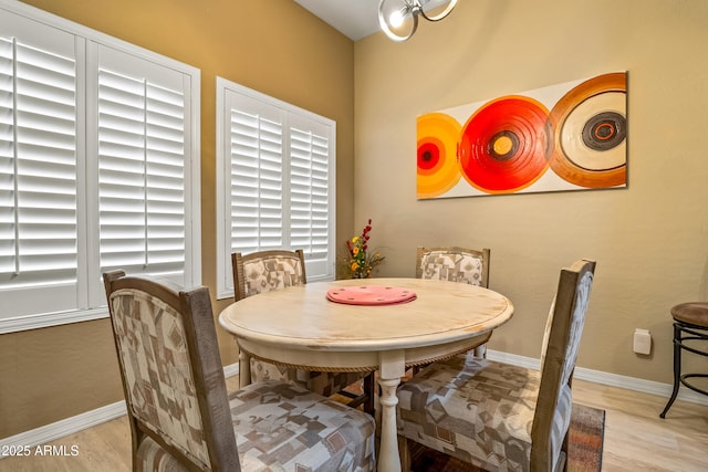 dining space featuring light wood-type flooring