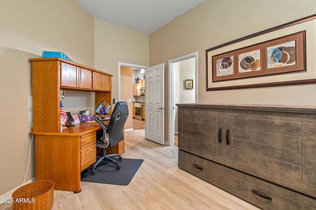 home office featuring light hardwood / wood-style flooring