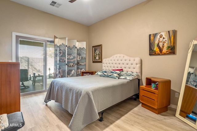 bedroom featuring access to outside and light wood-type flooring