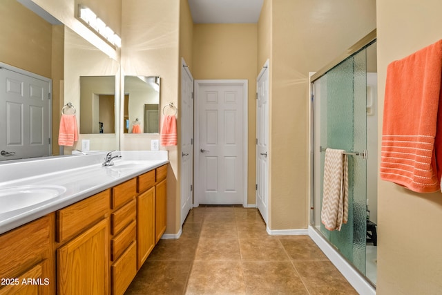 bathroom featuring vanity, tile patterned floors, and walk in shower