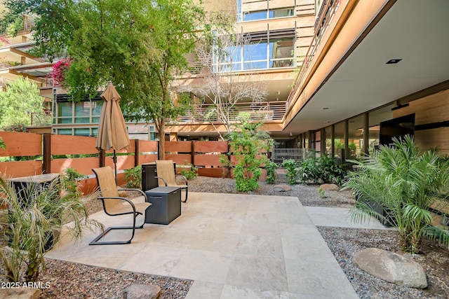 view of patio / terrace featuring fence