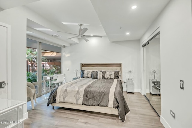 bedroom with recessed lighting, wood finished floors, visible vents, and baseboards