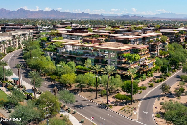 birds eye view of property featuring a mountain view