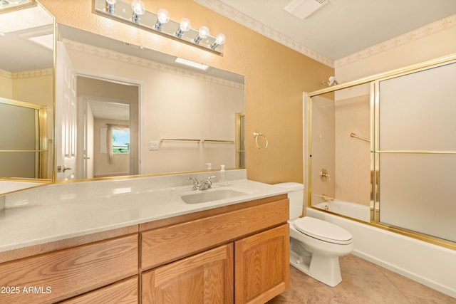 bathroom featuring vanity, visible vents, bath / shower combo with glass door, tile patterned floors, and toilet