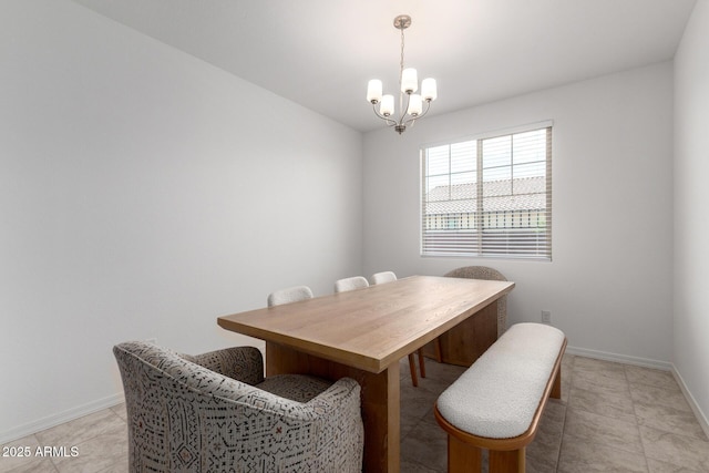10223 W Piccadilly Rd, Avondale, AZ 85392 - dining area featuring a chandelier, baseboards, and light tile patterned flooring