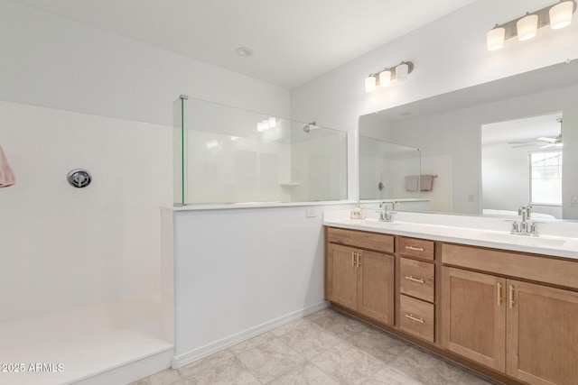10223 W Piccadilly Rd, Avondale, AZ 85392 - full bathroom featuring a walk in shower, double vanity, ceiling fan, and baseboards