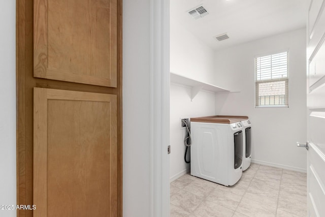 10223 W Piccadilly Rd, Avondale, AZ 85392 - washroom with washer and dryer and baseboards