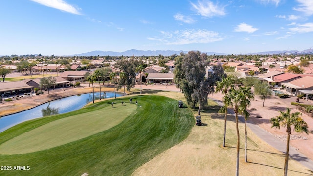 surrounding community featuring view of golf course, a water and mountain view, and a residential view