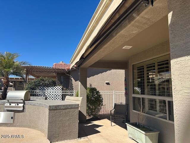 view of patio / terrace featuring area for grilling and an outdoor kitchen