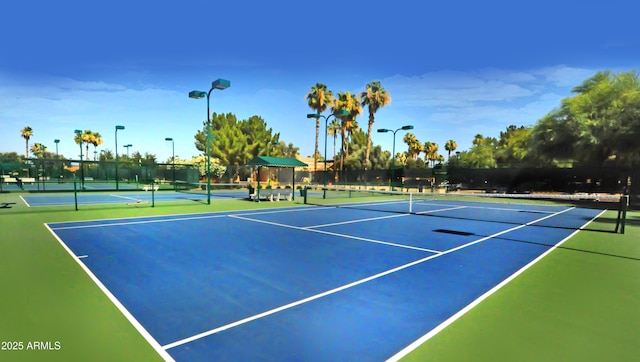 view of sport court featuring fence