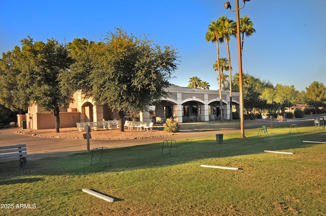 view of home's community with a yard