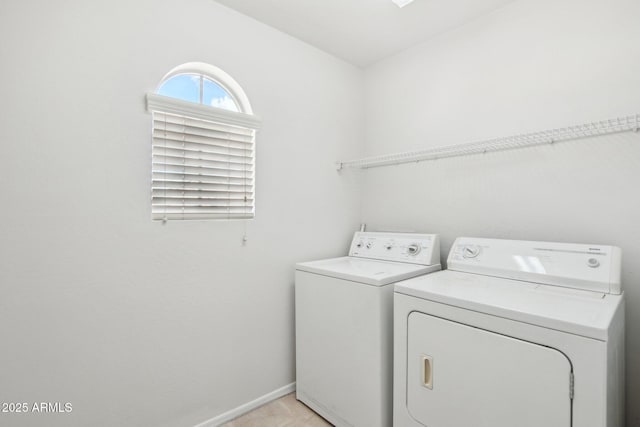 laundry area with independent washer and dryer