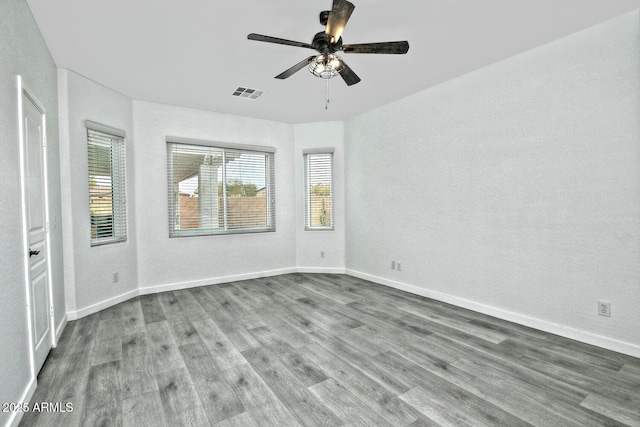 empty room featuring ceiling fan and light hardwood / wood-style floors