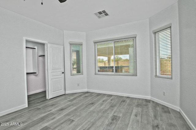 unfurnished bedroom featuring ceiling fan and light hardwood / wood-style floors