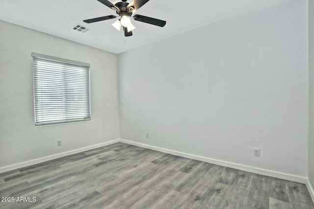 spare room featuring ceiling fan and hardwood / wood-style flooring