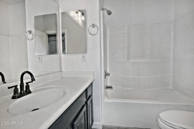 full bathroom featuring shower / tub combination, vanity, and toilet