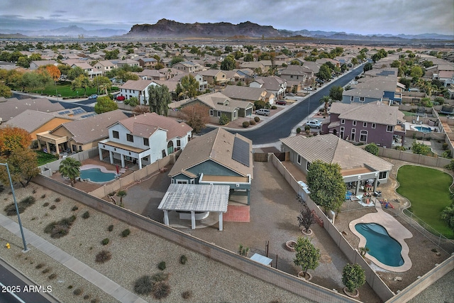 birds eye view of property with a mountain view