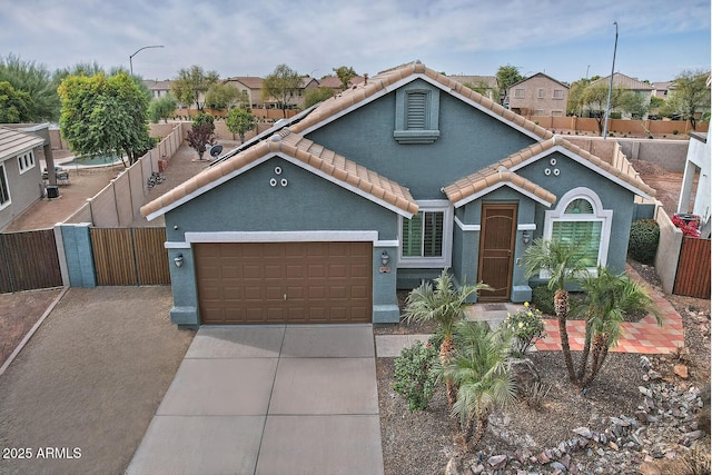 view of front of property featuring a garage