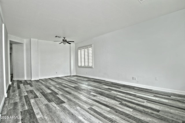 empty room with ceiling fan and wood-type flooring