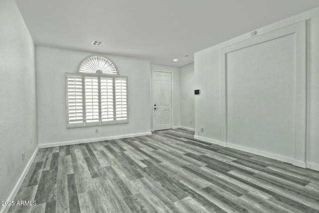 spare room featuring hardwood / wood-style flooring