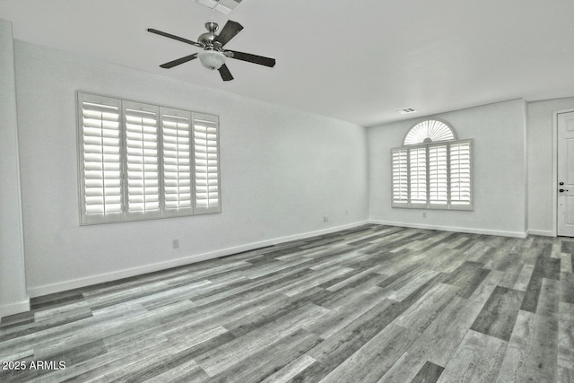 spare room featuring ceiling fan and hardwood / wood-style floors