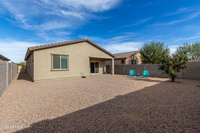 back of property with a patio area