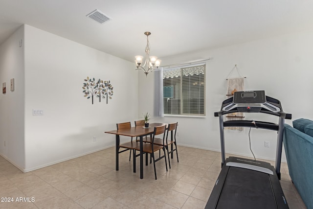 dining area with an inviting chandelier