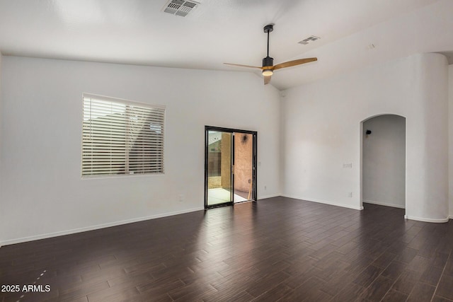 unfurnished room with vaulted ceiling, dark hardwood / wood-style floors, and ceiling fan