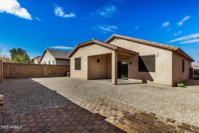 back of property featuring a patio