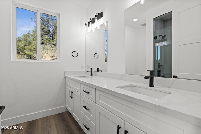 bathroom featuring vanity, hardwood / wood-style floors, and an enclosed shower