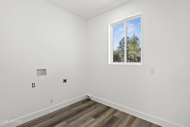 washroom with dark hardwood / wood-style flooring, hookup for a washing machine, and electric dryer hookup