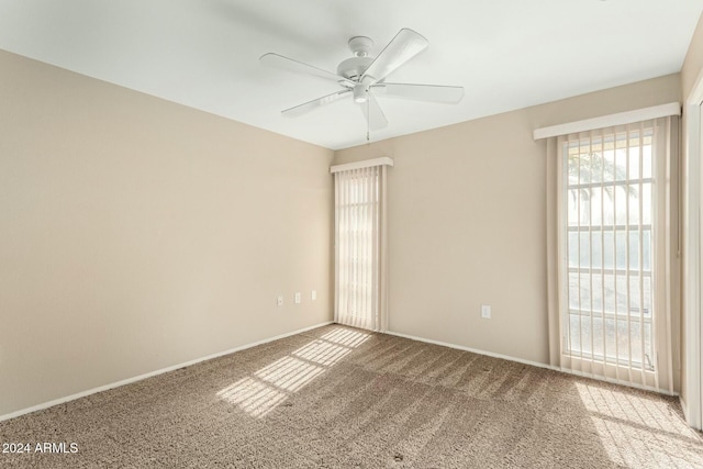 carpeted empty room with ceiling fan