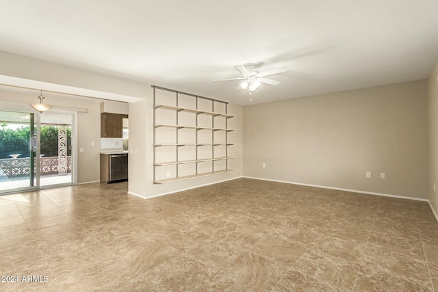 unfurnished living room featuring ceiling fan