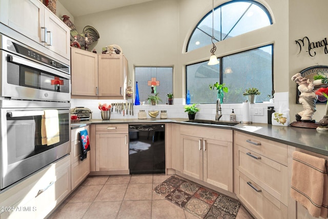 kitchen featuring dishwasher, backsplash, double oven, and sink