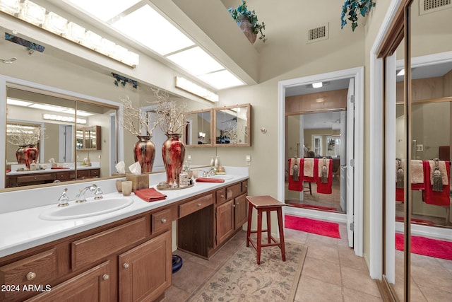 bathroom with tile patterned flooring and vanity