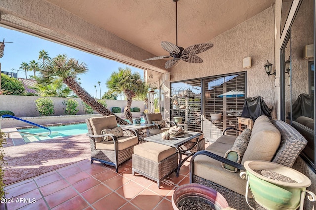 view of patio with a fenced in pool, ceiling fan, and an outdoor hangout area