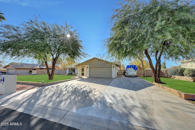 single story home featuring a garage and a front lawn