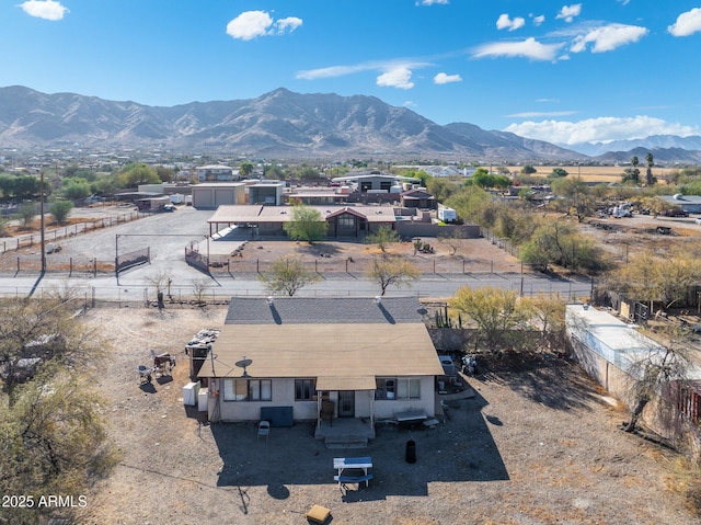 birds eye view of property featuring a mountain view